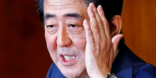 Japan's Prime Minister Shinzo Abe delivers his policy speech at the lower house of parliament in Tokyo February 12, 2015. REUTERS/Thomas Peter/File Photo