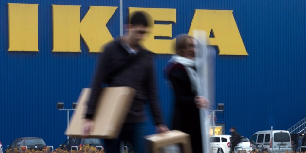 People walk in front of an IKEA shop in Berlin, Friday, Nov. 16, 2012. Swedish furniture giant Ikea expressed regret Friday that it benefited from the use of forced prison labor by some of its suppliers in communist East Germany more than two decades ago. (AP Photo/Markus Schreiber)