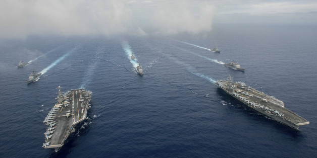 The Nimitz-class aircraft carriers USS John C. Stennis (CVN 74), and USS Ronald Reagan (CVN 76) (R) conduct dual aircraft carrier strike group operations in the U.S. 7th Fleet area of operations in support of security and stability in the Indo-Asia-Pacific in the Philippine Sea on June 18, 2016. Courtesy Jake Greenberg/U.S. Navy/Handout via REUTERS ATTENTION EDITORS - THIS IMAGE WAS PROVIDED BY A THIRD PARTY. EDITORIAL USE ONLY