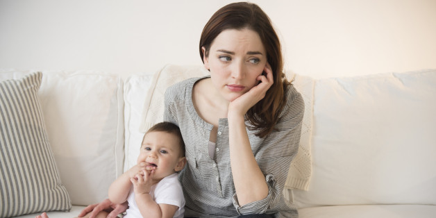 Mother with new baby suffering from postpartum depression