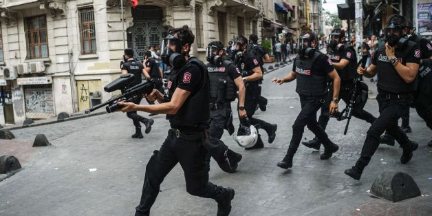 Turkish anti riot police officers fire rubber bullets to disperse demonstrators gathered for a rally staged by the LGBT community on Istiklal avenue in Istanbul on June 26, 2016.
Riot police fired tear gas and rubber bullets to disperse protesters defying a ban on the city's Gay Pride parade. Authorities in Turkey's biggest city had banned the annual parade earlier this month citing security reasons, sparking anger from gay rights activists.
/ AFP / OZAN KOSE (Photo credit should read OZAN KOSE/AFP/Getty Images)