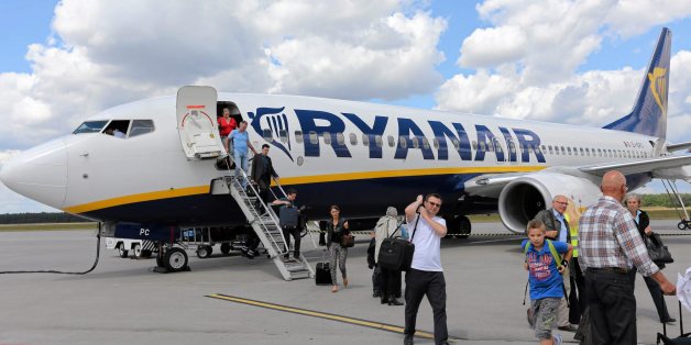 File photo of passangers leaving a Ryanair aircraft at Modlin airport near Warsaw, Poland June 26, 2014. Polish police acting on a tip-off from a hoax caller searched a Ryanair jet for an explosive device on July 25, 2015 but found nothing, police and the airline said. A spokesman for Warsaw police said a 48-year-old man had been detained after the hoax call was traced to his home. "This was an irresponsible prank," the spokesman, Mariusz Mrozek, told Polish broadcaster TVN24. Ryanair said the jet was on the tarmac at Warsaw's Modlin airport, waiting to board for a flight to Oslo, when the call came in. The airport was temporarily closed to incoming and outbound flights as a precaution. REUTERS/Franciszek Mazur/Agencja Gazeta THIS IMAGE HAS BEEN SUPPLIED BY A THIRD PARTY. IT IS DISTRIBUTED, EXACTLY AS RECEIVED BY REUTERS, AS A SERVICE TO CLIENTS. POLAND OUT. NO COMMERCIAL OR EDITORIAL SALES IN POLAND.