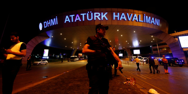 A riot police officer stands guard at the entrance of the Ataturk airport in Istanbul, Turkey, following a multiple suicide bombing, early June 29, 2016. REUTERS/Murad Sezer