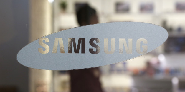In this Oct. 29, 2015 photo, a logo of Samsung Electronics Co. is seen at its shop in Seoul, South Korea. Samsung Electronics said Friday, Jan. 8, 2016, that its fourth-quarter profit rose 15 percent over a year earlier, a smaller-than-expected gain as the world's largest maker of smartphones and memory chips struggles to revive growth. (AP Photo/Lee Jin-man)