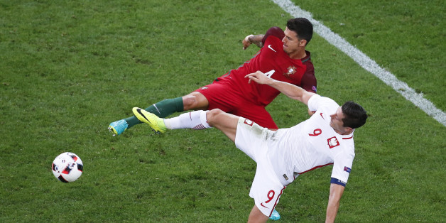 Football Soccer - Poland v Portugal - EURO 2016 - Quarter Final - Stade Velodrome, Marseille, France - 30/6/16 - Portugal's Jose Fonte and Poland's Robert Lewandowski in action. REUTERS/Eric Gaillard