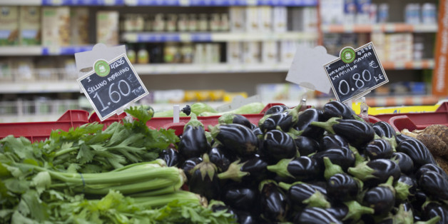 Euro price signs sit on vegetables, including celery, left, and aubergines, right, for sale inside a Carrefour SA supermarket, part of the Marinopoulos Group, in Limassol, Cyprus, on Monday, Sept. 8, 2014. The Cypriot economy contracted 0.3% in 2Q from previous quarter, vs 0.6% q/q drop in 1Q, according to seasonally adjusted estimates posted on Cyprus Statistical Service website. Photographer: Andrew Caballero-Reynolds/Bloomberg via Getty Images
