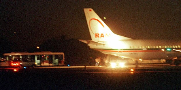 Passengers are seen disembarking from a Royal Air Maroc Boeing 737 early Thursday morning Aug. 26, 1999, at Barcelona airport, Spain, following a hijacking. The plane, carrying 88 passengers and crew was en route from Casablanca, Morocco, to Tunis, Tunisia, when it was forced to divert to Spain. No one was injured and no motive was given was the hijacking. (AP Photo/Cesar Rangel)