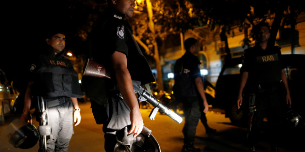 Security personnel keep watch, after gunmen stormed the Holey Artisan restaurant and took hostages, in the Gulshan area of Dhaka, Bangladesh July 2, 2016. REUTERS/Mohammad Ponir Hossain