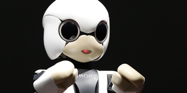 Humanoid communication robot Kirobo moves during its unveiling in Tokyo June 26, 2013. Dentsu Inc, Research Center for Advanced Science and Technology, the University of Tokyo, Robo Garage and Toyota announced that their jointly developed robot astronaut, called Kirobo, will be aboard the Kounotori 4 cargo spacecraft scheduled for launch from the Tanegashima Space Center to the International Space Station (ISS) on August 4, 2013, according to the organiser. REUTERS/Toru Hanai (JAPAN - Tags: BUSI