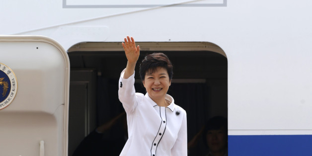 South Korean President Park Geun-hye waves as she embarks an airplane at the Seoul Air Base of South Korean air force in Seongnam, south of Seoul June 27, 2013, before she leaves for China. Park will arrive in Beijing on Thursday for her four-day state visit and will hold her first summit with Chinese President Xi Jinping. REUTERS/Lee Jae-Won (SOUTH KOREA - Tags: POLITICS)