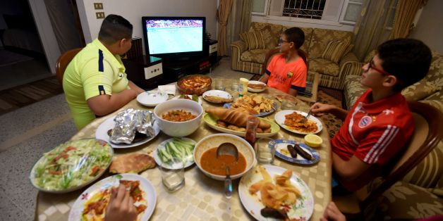 A Tunisian family watches a Euro 2016 football match during the break of Ramadan fast on June 17, 2016 in Tunis. / AFP / FETHI BELAID (Photo credit should read FETHI BELAID/AFP/Getty Images)