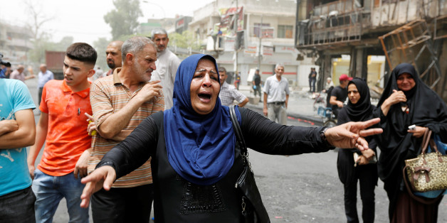 A woman reacts at the site after a suicide car bomb attack at the shopping area of Karrada, a largely Shi'ite district, in Baghdad, Iraq July 4, 2016. REUTERS/Ahmed Saad