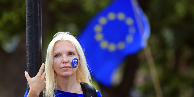 A woman stands still during a 'March for Europe' demonstration against Britain's decision to leave the European Union, in central London, Britain July 2, 2016. Britain voted to leave the European Union in the EU Brexit referendum. REUTERS/Paul Hackett