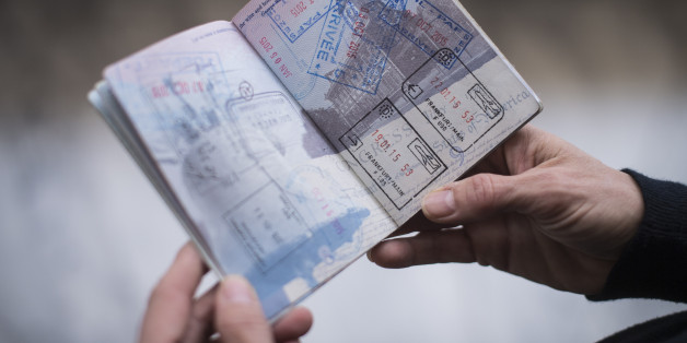 WASHINGTON, DC - JANUARY 8: Jennifer Cookoe, head of Africa for the Center for Advanced International Studies, shows off her passport while standing for a photo as she prepares to leave for a trip to Nigeria at her office in Washington, DC on Friday, January 08, 2016. Like many of Washingtons frequent international travelers in the wake of terrorists attacks in Mali, Paris and elsewhere, Cooke taking new precautions about where she stays and goes on her trips. (Photo by Jabin Botsford/The Washington Post via Getty Images)