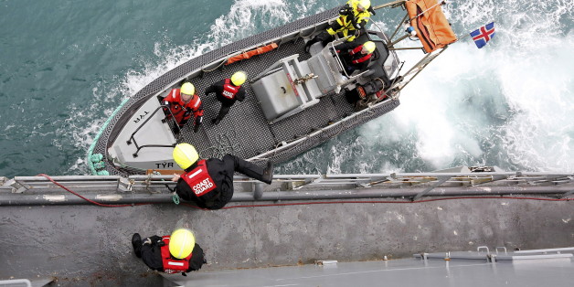 Icelandic coast guards prepare to patrol on a rubber dinghy from the vessel Tyr as they sail to off the eastern coast of Sicily March 17, 2015. The vessel Tyr is part of the EU border agency Frontex mission named Triton. With migration across the Mediterranean surging, the European Union's largest border operation is bracing for a record year of arrivals by sea, especially as summer brings calm waters between Italy and Libya. Picture taken March 17, 2015.
REUTERS/Alessandro Bianchi