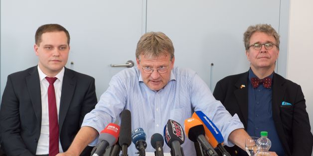 Joerg Meuthen (C), parliamentary group leader of the right-wing populist party AfD (Alternative for Germany) in the regional parliament of Baden-Wuerttemberg, southern Germany, is flanked by AfD parliamentary group members Anton Baron (L) and Heinrich Fiechtner as he gives a press conference on July 5, 2016 at the regional parliament in Stuttgart.
Meuthen and twelve AfD delegates left their parliamentary group after another parliamentary group member, Wolfgang Gedeon, had made anti-Semitic remarks. The incident has triggered a power struggle in the party's leadership. / AFP / dpa / Bernd WEISSBROD / Germany OUT (Photo credit should read BERND WEISSBROD/AFP/Getty Images)