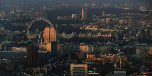 The early morning sun lights buildings in an aerial photograph from The View gallery at the Shard, western Europe's tallest building, in London January 8, 2013. The View, the public viewing deck accessible by high speed elevators on the 309 metre (1,013 feet) Shard building, opens on February 1. Picture taken January 8, 2013. REUTERS/Stefan Wermuth (BRITAIN - Tags: TRAVEL CITYSCAPE)