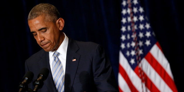 U.S. President Barack Obama pauses during remarks on recent police-involved shootings in Louisiana and Minnesota after arriving ahead of a NATO Summit in Warsaw, Poland July 8, 2016. REUTERS/Jonathan Ernst