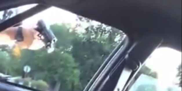 EDS NOTE: GRAPHIC CONTENT - This still image taken from video by Diamond Reynolds shows a police officer pointing a gun at her boyfriend, Philando Castile, during a traffic stop on Wednesday, July 6, 2016 in Falcon Heights, Minn. The officer shot Castile, and Reynolds apparently livestreamed the aftermath on Facebook from the passenger seat. As the video and word of the shooting spread, scores of people gathered at the scene and outside the hospital where Castile died. (Diamond Reynolds via AP)