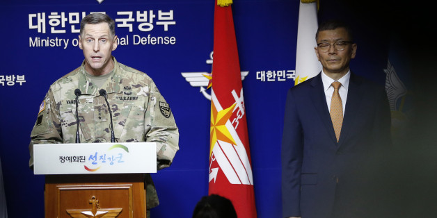 Lt. Gen. Thomas Vandal, the commander of U.S. Forces Korea's Eighth Army, center, speaks to the media about deploying the Terminal High-Altitude Area Defense, or THAAD as South Korean Defense Ministry's deputy minister for policy Yoo Jeh-seung, right, listens during a media briefing at the Defense Ministry in Seoul, South Korea, Friday, July 8, 2016. (AP Photo/Lee Jin-man)