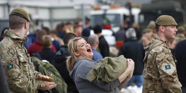 Soldiers and volunteers fill sand bags to assist with flood relief in York, in northern England, December 28, 2015. REUTERS/Darren Staples