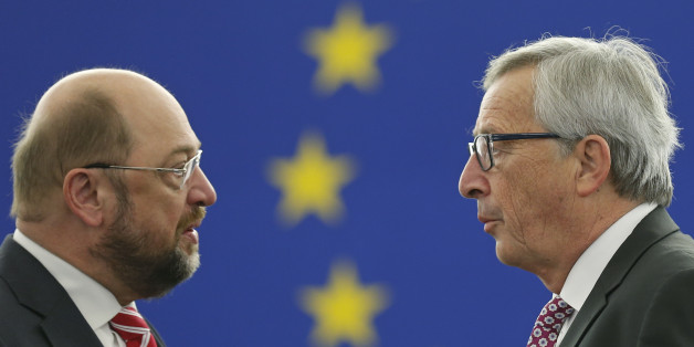European Commission President Luxembourg Jean-Claude Juncker (R) talks to European Parliament President Martin Schulz as he arrives to address the European Parliament to present a plan on growth, jobs and investment, in Strasbourg, November 26, 2014. Juncker presented a plan on Wednesday to leverage some 300 billion euros ($375 billion) of largely private new investment in the European Union, saying it was time to kick-start growth without adding to public debt. REUTERS/Vincent Kessler (FRANCE