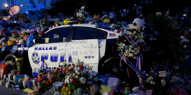 A makeshift memorial at Dallas Police Headquarters is seen one day after a lone gunman ambushed and killed five police officers at a protest decrying police shootings of black men, in Dallas, Texas, U.S., July 8, 2016. REUTERS/Shannon Stapleton