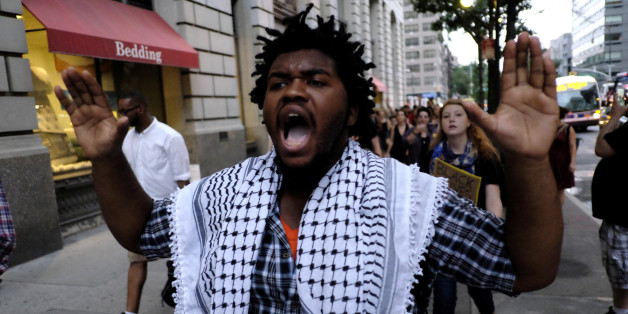 A man shouts slogans to the police as people take part in a protest against the killing of Alton Sterling, Philando Castile and in support of Black Lives Matter during a march along Manhattan's streets in New York July 8, 2016. REUTERS/Eduardo Munoz