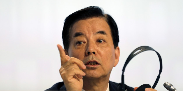 South Korea's Defense Minister Han Min Koo speaks to his aid before a plenary session at the 15th International Institute for Strategic Studies Shangri-la Dialogue, or IISS, Asia Security Summit on Saturday, June 4, 2016, in Singapore. (AP Photo/Wong Maye-E)