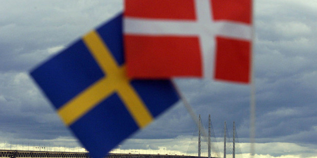 Swedish (L) and Danish flags are seen near the Oresund Bridge July 1. The bridge-tunnel link between Denmark and Sweden was inaugurated Saturday by Queen Margrethe II of Denmark and King Carl XVI Gustaf of Sweden. The rail-and-road link connects the Danish capital Copenhagen with southern Sweden across the 16-kilometer wide Oresund strait.
hen/hsh