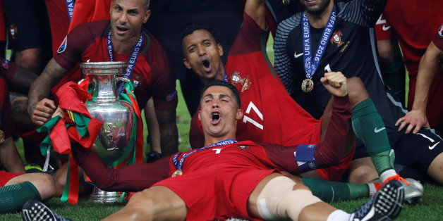 Football Soccer - Portugal v France - EURO 2016 - Final - Stade de France, Saint-Denis near Paris, France - 10/7/16Portugal's Cristiano Ronaldo celebrates with Ricardo Quaresma, Nani, Rui Patricio and the trophy after winning Euro 2016 REUTERS/Carl RecineLivepic TPX IMAGES OF THE DAY