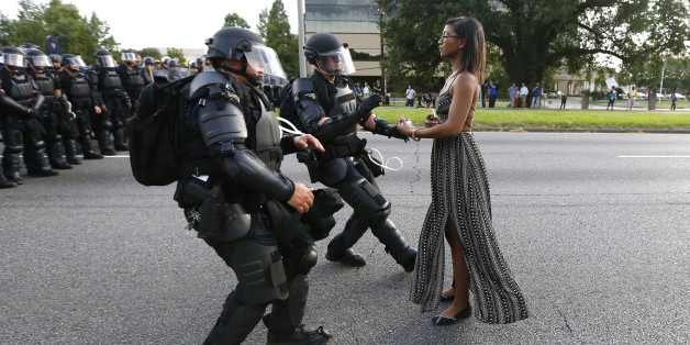 A demonstrator protesting the shooting death of Alton Sterling is detained by law enforcement near the headquarters of the Baton Rouge Police Department in Baton Rouge, Louisiana, U.S. July 9, 2016. REUTERS/Jonathan Bachman TPX IMAGES OF THE DAY