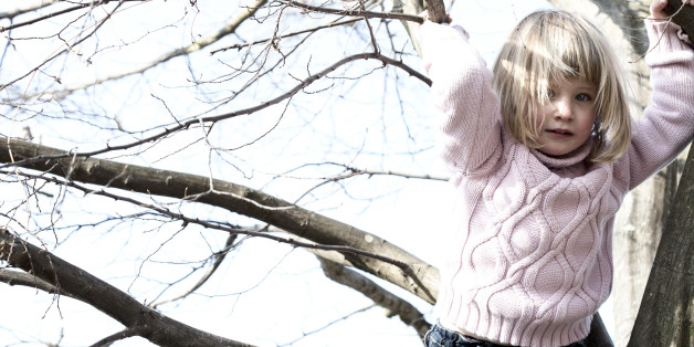 Girl playing on tree