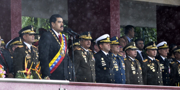 President Nicolas Maduro, second left, waits to speak during the Venezuela Independence Day parade in Caracas, Venezuela, on Tuesday, July 5, 2016. Venezuela celebrated its 205th anniversary of Independence Day from Spain with a military parade in Caracas. President Nicolas Maduro, at the event, spoke about the need for a progressively stronger, increasingly larger, military power for an independent republic. Photographer: Carlos Becerra/Bloomberg via Getty Images