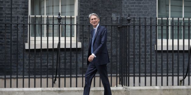 British Foreign Secretary Philip Hammond walks to 10 Downing Street in central London on July 13, 2016 after New British Prime Minister Theresa May takes office following the formal resignation of David Cameron.
Theresa May took office as Britain's second female prime minister on July 13 charged with guiding the UK out of the European Union after a deeply devisive referendum campaign ended with Britain voting to leave and David Cameron resigning.
/ AFP / OLI SCARFF (Photo credit should read OLI SCARFF/AFP/Getty Images)