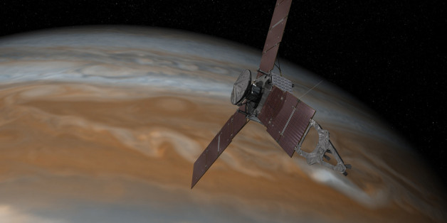 This artist's rendering provided by NASA and JPL-Caltech shows the Juno spacecraft above the planet Jupiter. Five years after its launch from Earth, Juno is scheduled to go into orbit around the gas giant on Monday, July 4, 2016. (NASA/JPL-Caltech via AP)