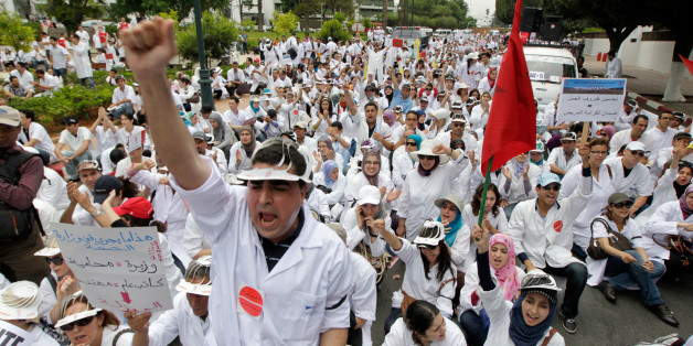 Teachers of public medical schools, accompanied by hundreds of students, demonstrate to prohibit the upcoming opening of private medical schools in Rabat May 25, 2011. REUTERS/Youssef Boudlal (MOROCCO - Tags: HEALTH POLITICS CIVIL UNREST)