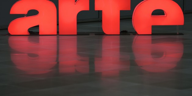 TO GO WITH AFP STORY BY ARNAUD BOUVIER
The logo of public Franco-German TV network Arte (Association relative à la télévision européenne) is pictured in the courtyard of Arte in Strasbourg, eastern France, on March 1, 2016.
Less historical documentaries or sharp thematic evenings, more news in innovative formats: the Franco-German channel Arte, launched in 1992 and is financed by the broadcasting license-fee collected in France and Germany, is now focusing on the info for 'anchored in the present' a strategy that seems to pay in terms of hearing. / AFP / FREDERICK FLORIN (Photo credit should read FREDERICK FLORIN/AFP/Getty Images)