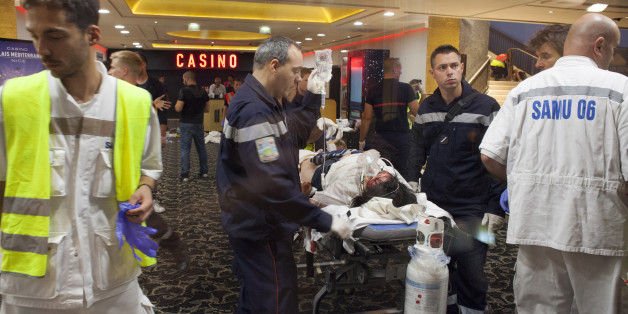 NICE, FRANCE - JULY 14: Victims are given medical assistance at Casino Du Palais De La Mediterranee, following a truck attack on Promenade des Anglais on July 14, 2016 in Nice, France. A French-Tunisian attacker killed 84 people as he drove a truck through crowds, gathered to watch a firework display during Bastille Day celebrations. The attacker then opened fire on people in the crowd before being shot dead by police. (Photo by Remi Benali/Getty Images)