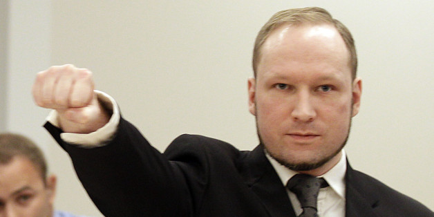 Mass murderer Anders Behring Breivik, makes a salute after he arrives at the court room in a courthouse in Oslo Friday Aug. 24, 2012 . Breivik has been declared sane and sentenced to prison for bomb and gun attacks that killed 77 people last year. (AP Photo/Frank Augstein)