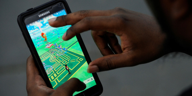 A virtual map of Bryant Park is displayed on the screen as a man plays the augmented reality mobile game "Pokemon Go" by Nintendo in New York City, U.S. July 11, 2016. REUTERS/Mark Kauzlarich