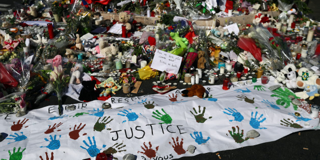 NICE, FRANCE - JULY 16: Flowers and tributes are laid on the Promenade des Anglais on July 16, 2016 in Nice, France. Five people believed to be linked to the man who killed 84 people in Nice are in police custody according to a statement by the Paris prosecutor's office after a French-Tunisian attacker killed 84 people as he drove a lorry through crowds who had gathered to watch a firework display during Bastille Day Celebrations. The attacker then opened fire on people in the crowd before bein