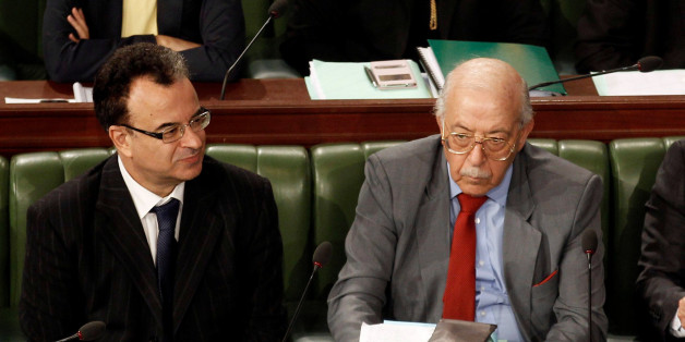 Tunisia's Finance Minister Slim Chaker and central bank governor Chadli Ayari attend a plenary session in Tunis, Tunisia, May 10, 2016. The Tunisian parliament on Thursday approved a new banking bill to modernize financial services, a second reform called for by the International Monetary Fund after a disputed central bank law passed last month. Picture taken May 10, 2016. REUTERS/Zoubeir Souissi