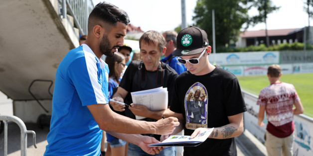 LEICESTER, ENGLAND - JULY 12: Leicester City's Riyad Mahrez signs autographs during the Leicester City Pre-Season tour of Austria at Stegersbach Training Facility on July 12, 2016 in Stegersbach, Austria. (Photo by Plumb Images/Leicester City FC via Getty Images)