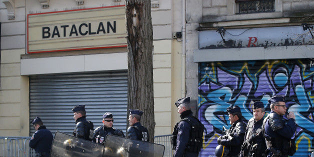 Riot police officers guard the Bataclan concert hall in Paris, Thursday, March 17, 2016. French lawmakers leading an investigation into the Nov. 13 attacks and some of the first responders at the Bataclan concert hall that night returned Thursday to re-enact the horror that left a total of 130 people dead across Paris. (AP Photo/Michel Euler)