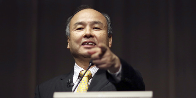FILE - In this Nov. 4, 2014 file photo, SoftBank founder and Chief Executive Officer Masayoshi Son speaks during a news conference in Tokyo. Japanese Internet company SoftBank Group Corp., which is struggling to turn around Sprint in the U.S., is reporting a 27 percent drop in profit for the fiscal year ended March 31, compared to the previous year. (AP Photo/Eugene Hoshiko, File)