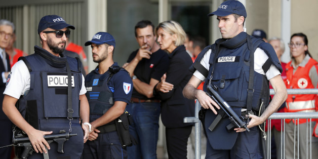 French Police stand in front of a Chapel of Rest to welcome families of victims, three days after a truck mowed through revelers, on the famed Promenade des Anglais in Nice, southern France, Sunday, July 17, 2016. French authorities detained two more people Sunday in the investigation into the Bastille Day truck attack on the Mediterranean city of Nice that killed at least 84 people, as authorities try to determine whether the slain attacker was a committed religious extremist or just a very ang