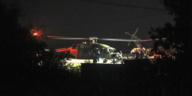A Turkish Blackhawk helicopter sits on the tarmac of the airport of Alexandroupolis, northern Greece, Sunday, July 17, 2016. The Greek government said a Turkish Blackhawk helicopter will be returned to Turkey "as soon as possible" but it will examine the asylum demand made by eight military personnel who were arrested after landing Saturday. (Giannis Moιsiadis/InTime News via AP)