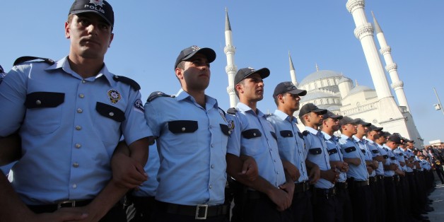 ANKARA, TURKEY - JULY 17: Police officers are seen standing during a funeral ceremony of Infantry Staff Colonel Sait Erturk, Master Gunner Sergeant Major Bulent Aydin, police officers Firat Bulut, Muhammet Oguz Kilinc, Huseyin Kalkan, Koksal Tasalti, Chief of Police Cuneyt Bursa, Deputy Police Chief Kubra Doganay, who were martyred in Parallel State/Gulenist Terrorist Organization's failed military coup attempt. Funeral ceremony is held at Kocatepe Mosque in Ankara, Turkey on July 17, 2016. Turkish Prime Minister Binali Yildirim, Leader of the Republican Peoples Party (CHP) Kemal Kilicdaroglu and the Nationalist Movement Party, Devlet Bahceli, Chief of the General Staff of the Turkish Armed Forces, Hulusi Akar attend the funeral ceremony. (Photo by Rasit Aydogan/Anadolu Agency/Getty Images)