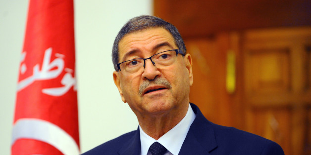 Tunisian Premier Habid Essid addresses the media following a cabinet meeting in Tunis, Tuesday, Match 8, 2016. The death toll from clashes between Tunisian forces and extremist attackers near the Libyan border has risen to 55, including 36 attackers, Essid said Tuesday. (AP Photo/Hassene Dridi)